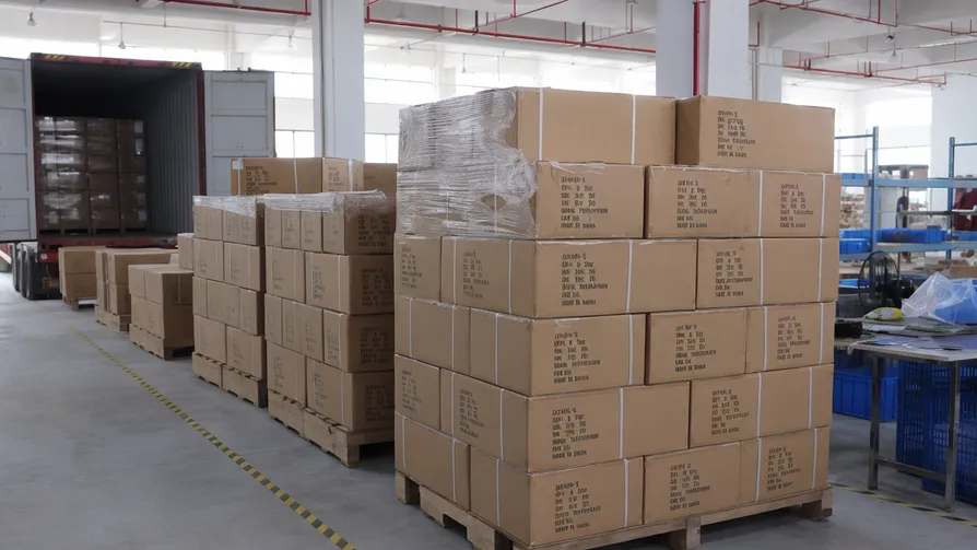 JXSOL solar lighting products packed for container export with batch-coded cartons