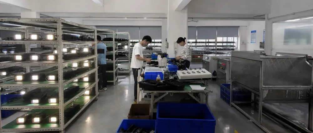 JXSOL factory pre-shipment inspection line with aging racks and waterproof testing stations for outdoor solar lights
