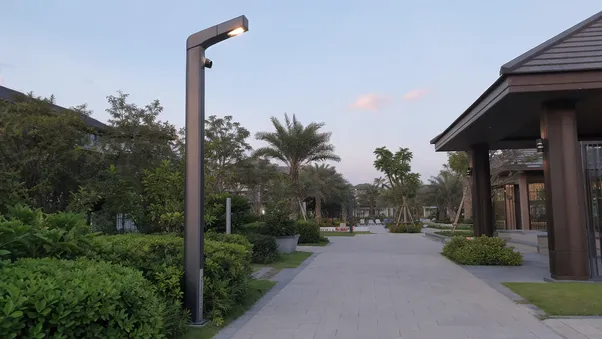 Integrated smart solar pole on resort pathway with no visible battery box or external wiring