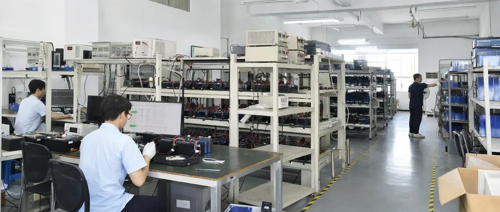JXSOL in-house battery testing and inspection lab with aging racks and cell matching equipment