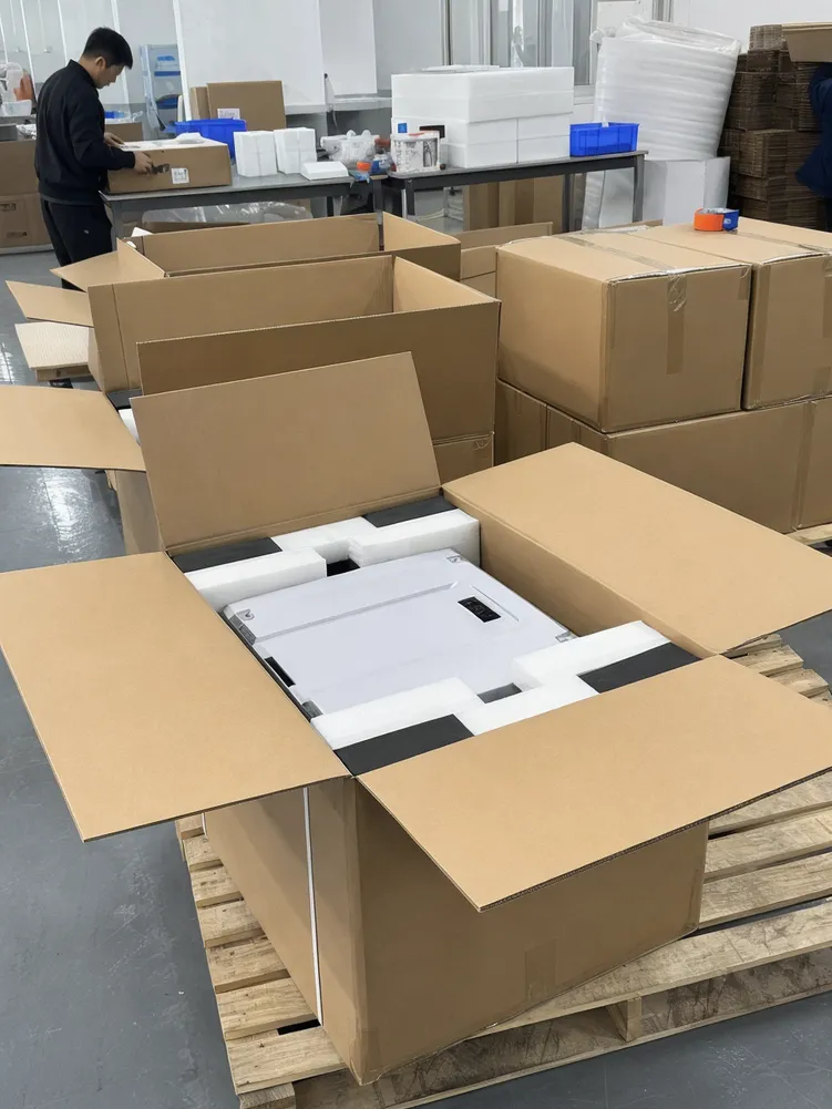Reinforced carton packaging for stackable home battery modules with foam inserts and corner protection