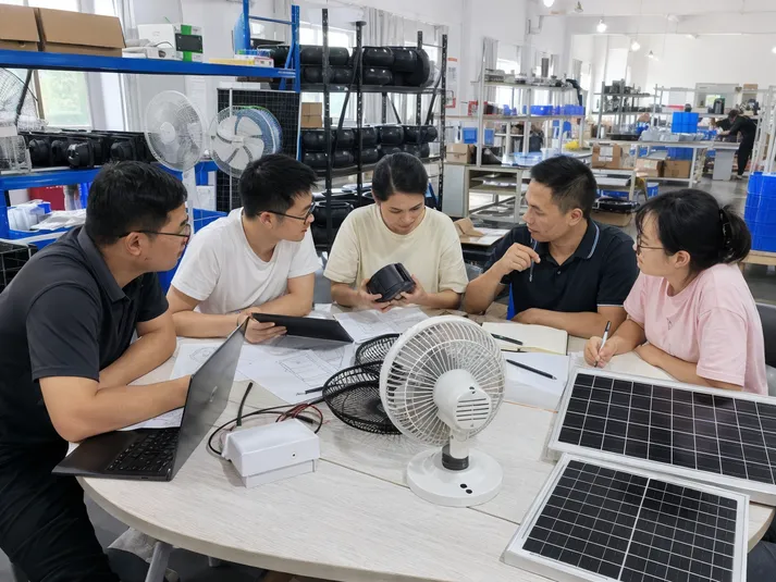 JXSOL engineering team reviewing solar fan OEM specifications