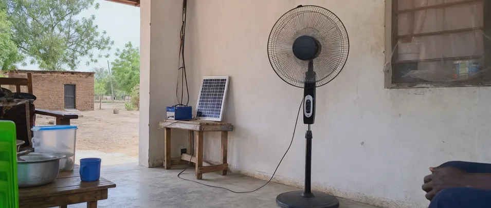 Solar stand fan in off-grid household setting in rural Africa
