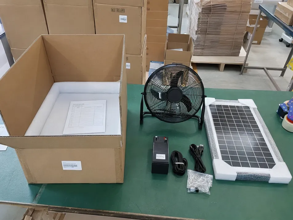 Solar fan export packing showing carton layout with panel, battery, cable, and accessories in defined sequence