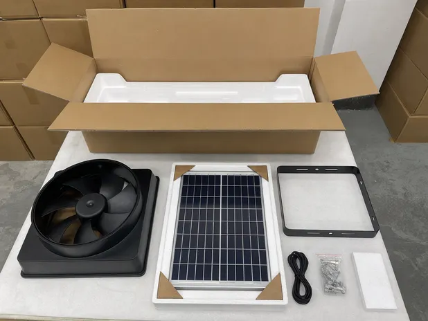 Standard export carton contents for solar exhaust fan showing fan housing, solar panel, bracket, cable, and hardware