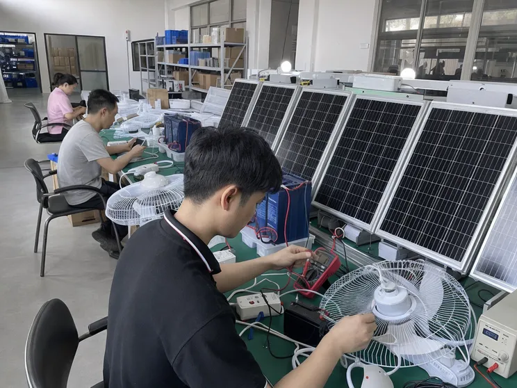 Solar panel output testing and battery charge-discharge verification at JXSOL factory for solar powered fan kits