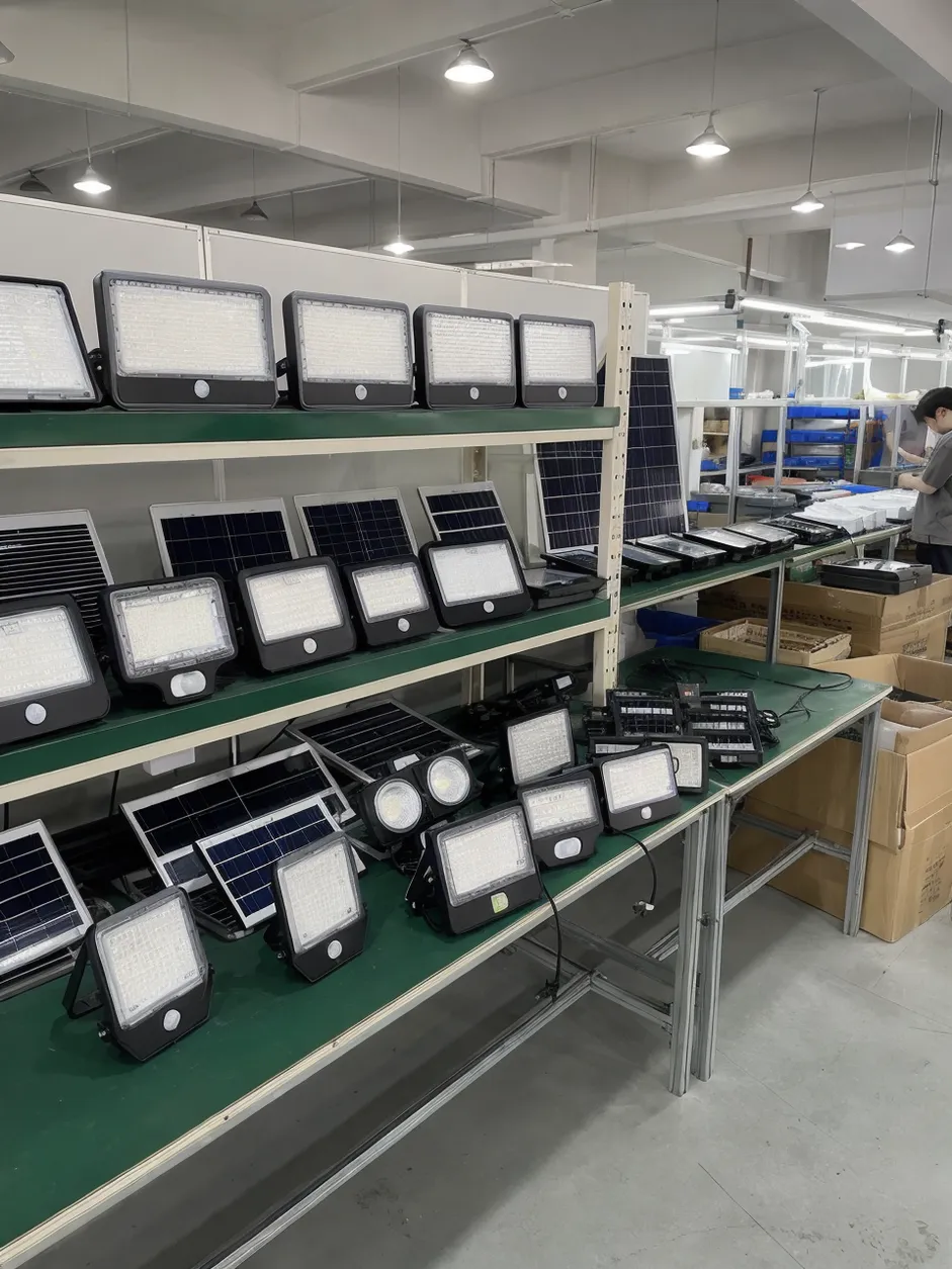 JXSOL solar flood and security lights product range displayed in manufacturing facility