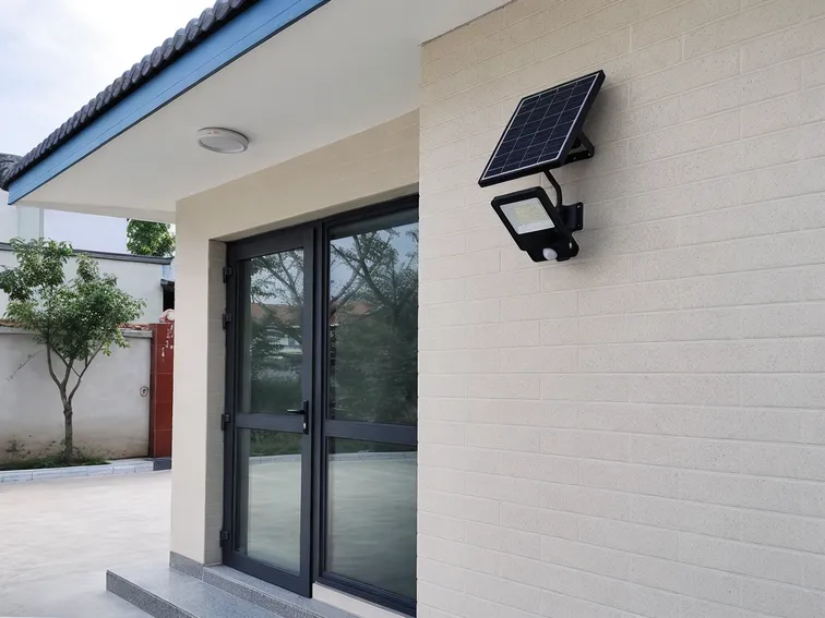 PIR solar security light installation showing optimal mounting height and sensor orientation for maximum detection coverage