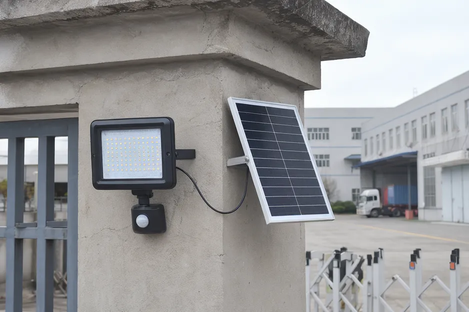 JXSOL solar motion sensor flood light with PIR sensor and monocrystalline panel mounted on perimeter wall