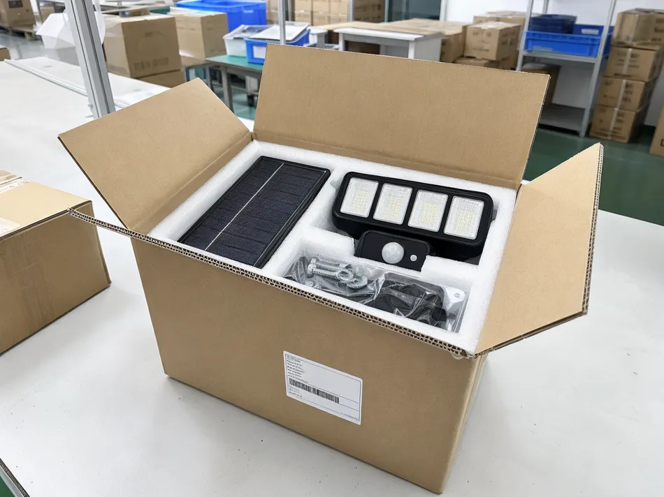 Solar security light carton with batch code label, foam-cushioned compartments, and separated hardware pack