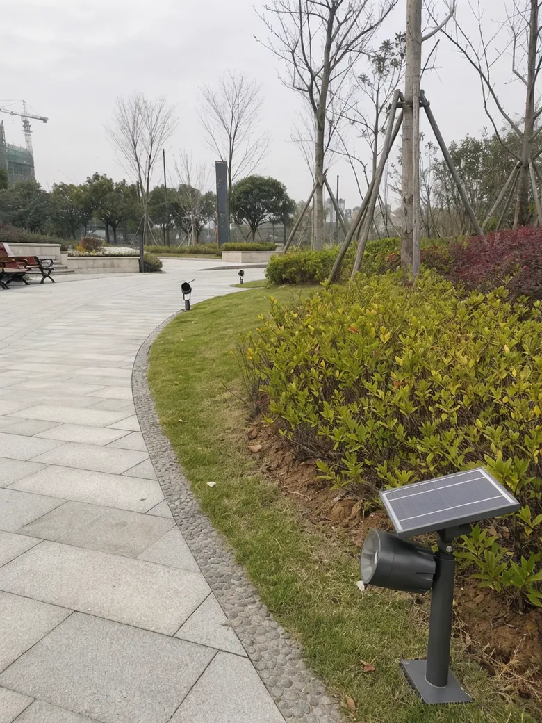 Solar landscape lighting installed in a public park with vandal-resistant housing for municipal applications