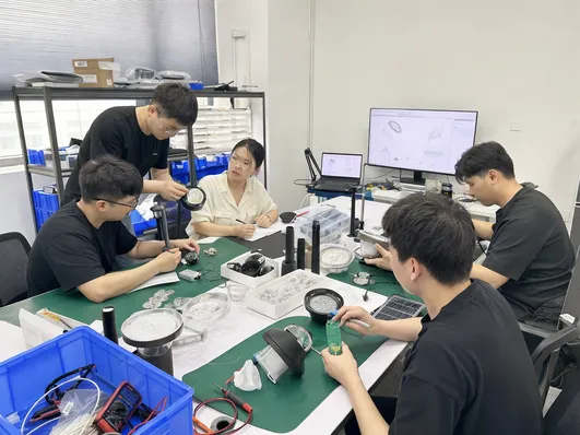 JXSOL optical and electrical engineering team working on OEM solar garden lighting projects