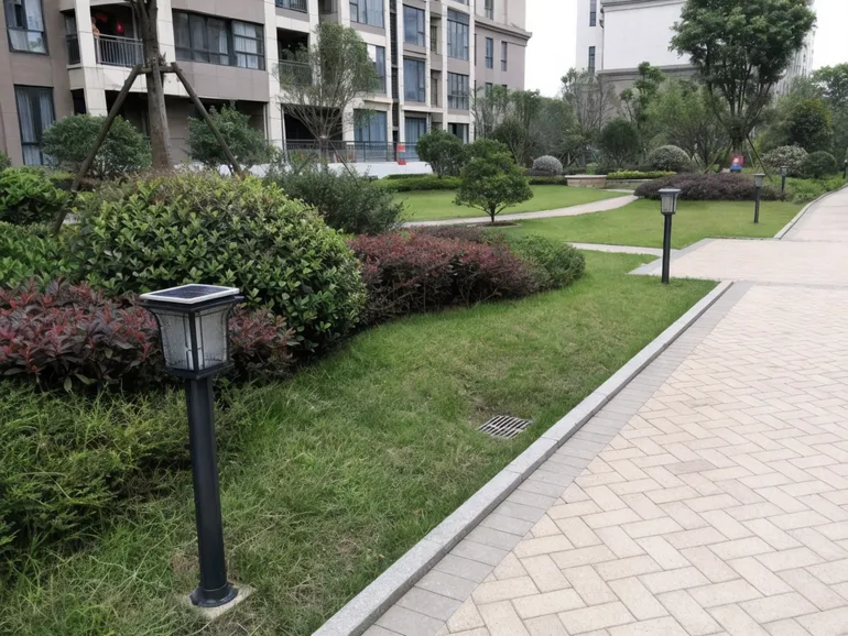 Solar garden lights installed uniformly across a managed residential community common area
