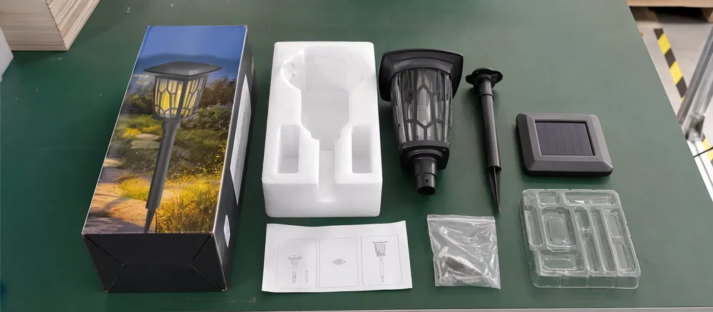 Solar garden light retail packaging showing color box, inner protection, and accessory pack layout