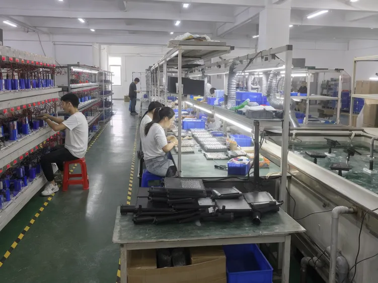 JXSOL production line showing battery aging racks, LED binning station, and IP waterproof testing for solar landscape lighting