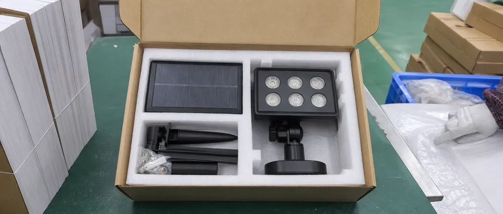 Solar spotlight inner packing with molded foam tray protecting adjustable head and accessory pack