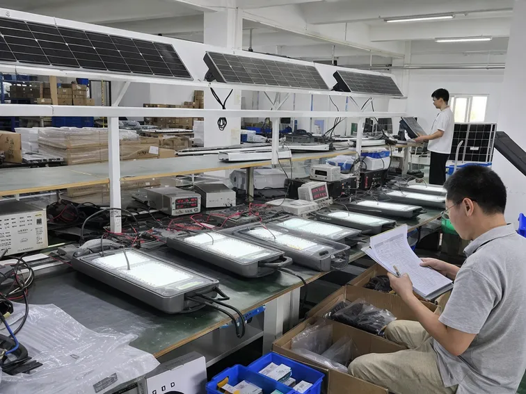 JXSOL 100% outgoing inspection process for solar parking lot lights showing test bench and quality control station