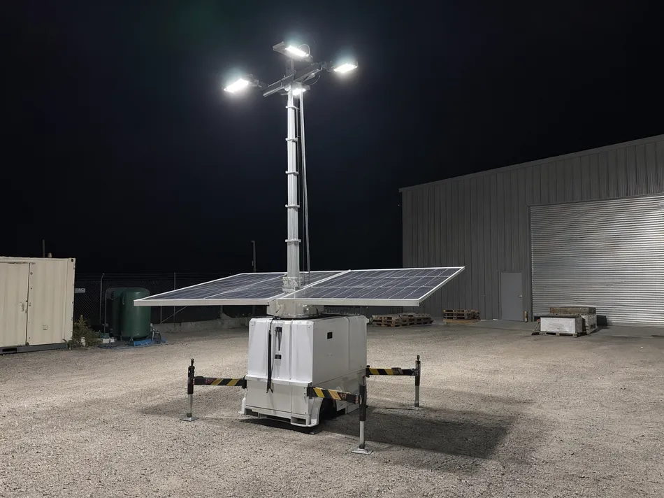 Solar lighting tower deployed at a remote industrial yard operating after dark without grid access
