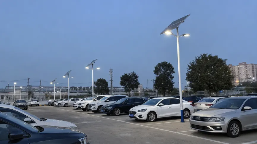Municipal public parking area illuminated by solar parking lot fixtures