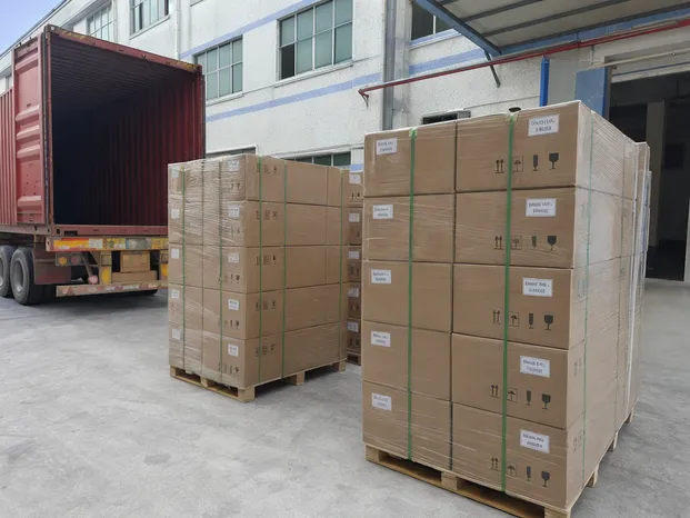 Solar parking lot light cartons packed for container loading with batch code labels visible