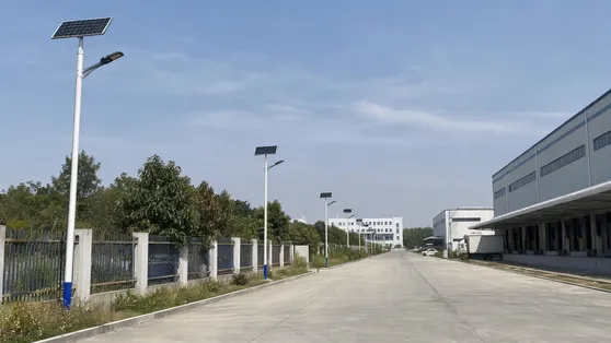 Solar pole lights along an industrial compound perimeter road