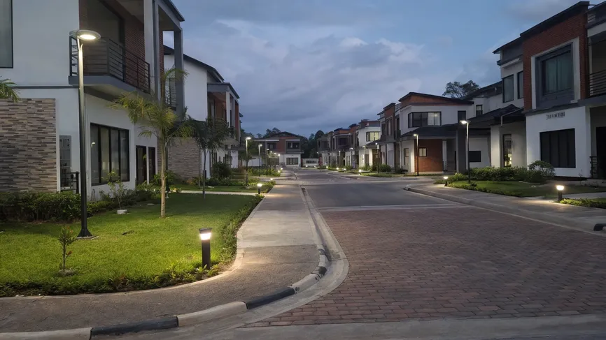 Solar yard lights installed across a residential villa compound development with uniform outdoor lighting