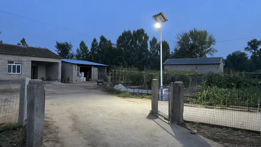 Solar yard light providing illumination at a rural farm compound without grid connection