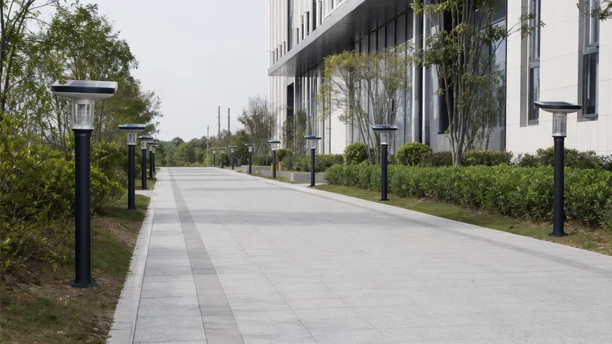 Solar walkway lights installed at uniform spacing along a commercial pathway project