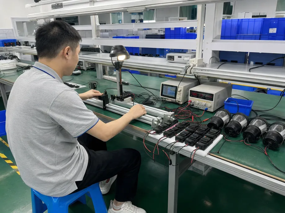 Dedicated test bench verifying PIR sensor trigger distance and dusk-to-dawn threshold on solar pathway light controllers