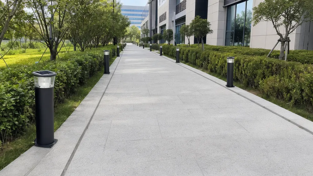 Solar bollard lights installed along a commercial pathway showing typical 3-6 meter spacing pattern