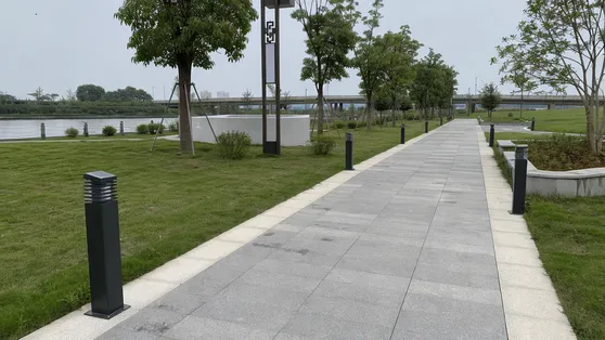 Solar bollard lights installed along a municipal park pathway
