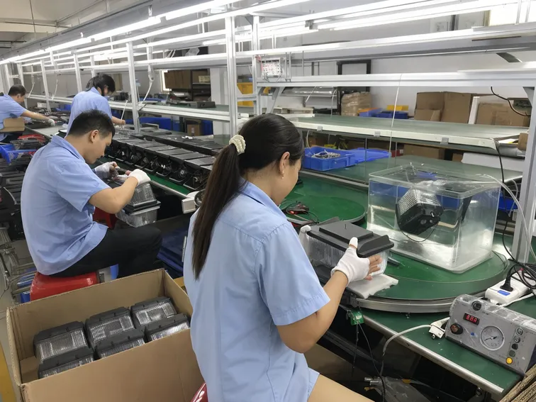 JXSOL production QC inspection line testing battery packs, LED modules, and waterproof seals for solar fence lights