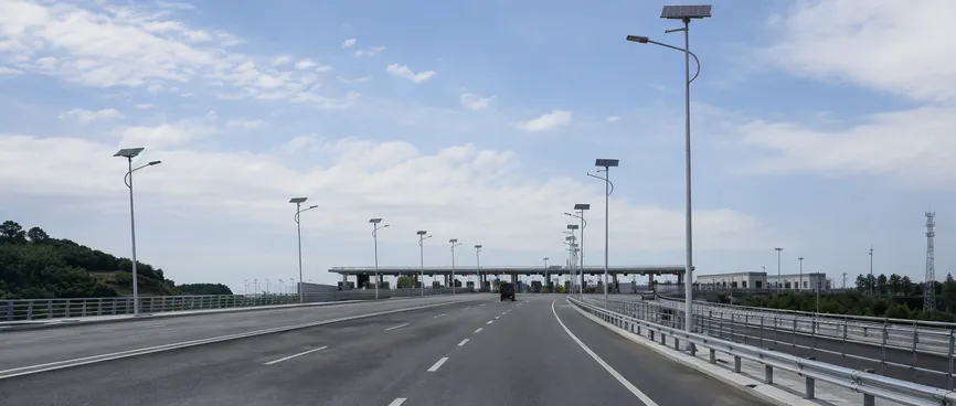 Solar lighting at a highway bridge approach and toll station area