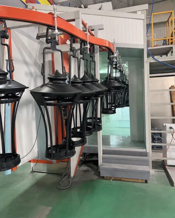 Automated powder coating with consistent film thickness on decorative park lighting housings