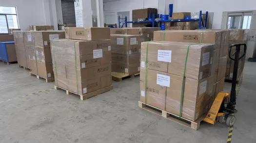 Palletized solar road light cartons organized by SKU with batch code labels for project-site receiving