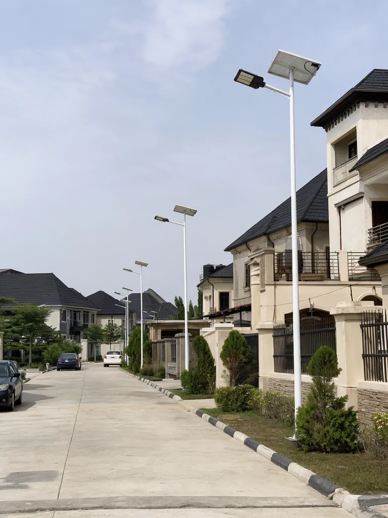Solar road lights along a residential development community road with 6-8m poles