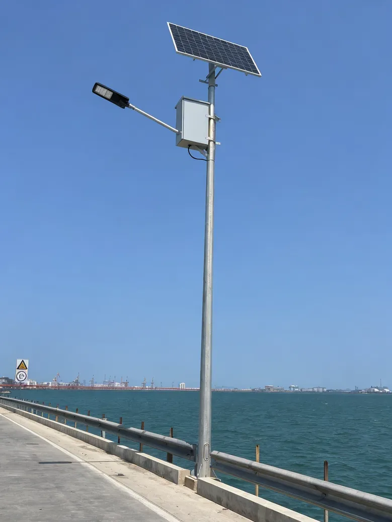 IP67-rated split solar street light with elevated battery box installed on coastal road