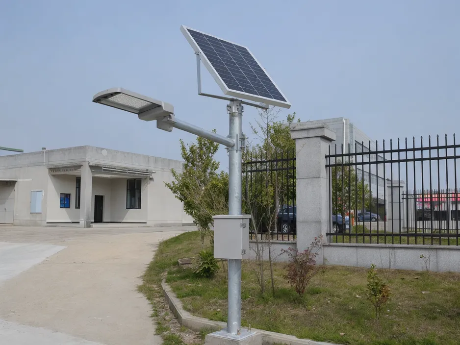 Split solar street light pole with panel mounting bracket and battery enclosure