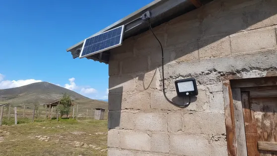 Separate panel solar wall lights installed on off-grid building in rural area
