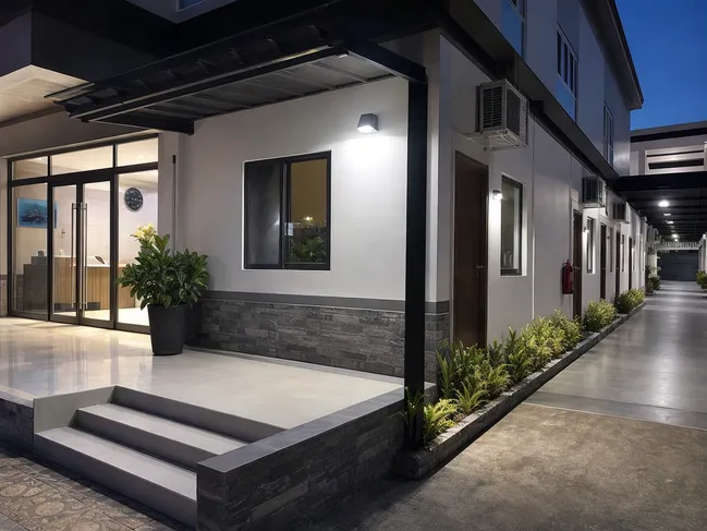 Solar motion sensor wall lights at hotel entrance and exterior corridor