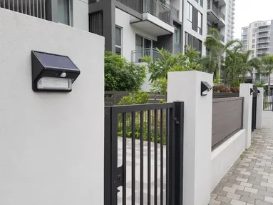 Solar wall lights installed at residential compound entrance gates