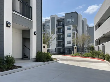 Solar wall lights installed across a multi-building residential development entrance