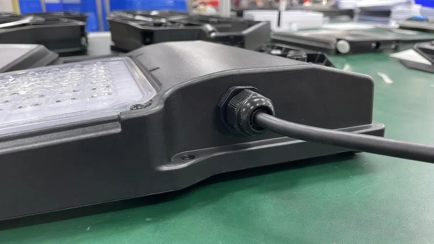 IP67-rated cable entry gland with defined torque specification on solar wall light fixture