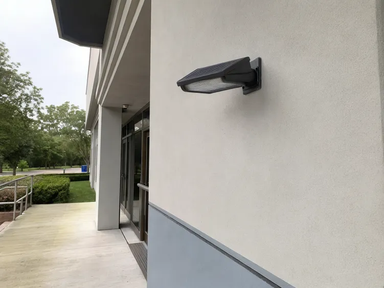 IP67 solar wall light installed on a public community center exterior wall